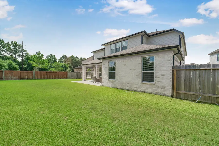 Expansive backyard offers endless possibilities for play and entertaining.