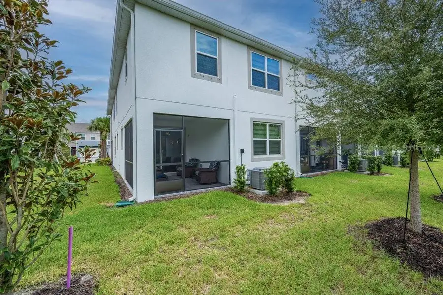 Exterior details and patio area of a home in Bloomingdale Townes, Brandon (Image 21).