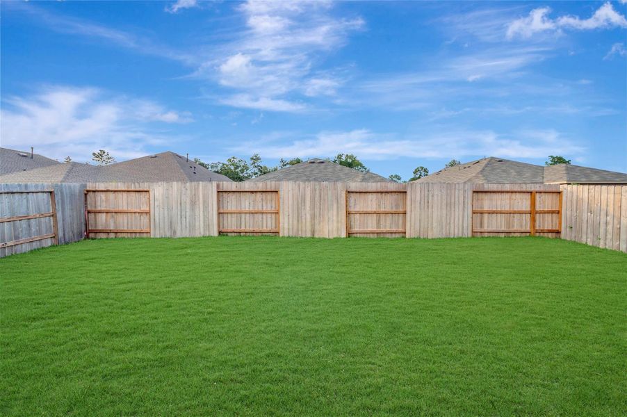 Exterior details and patio area of a home in Pinewood at Grand Texas, New Caney (Image 20).