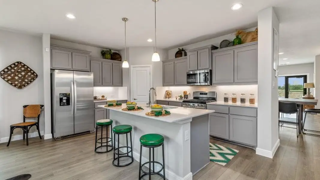 Kitchen - All Home and community information, including pricing, included features, terms, availability and amenities, are subject to change at any time without notice or obligation. All Drawings, pictures, photographs, video, square footages, floor plans, elevations, features, colors and sizes are approximate for illustration purposes only and will vary from the homes as built.