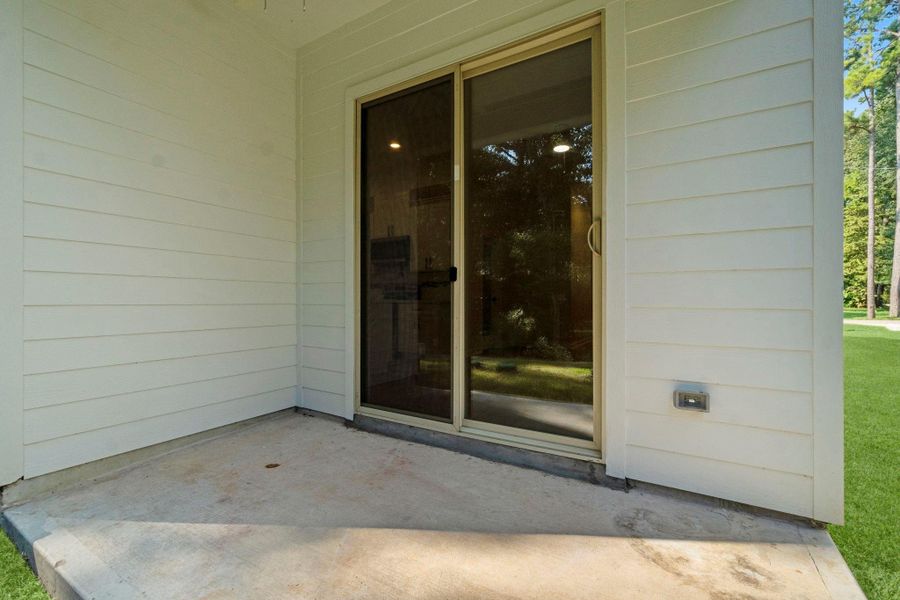 Front exterior of a new home in , Conroe, TX, highlighting curb appeal (Image 1).