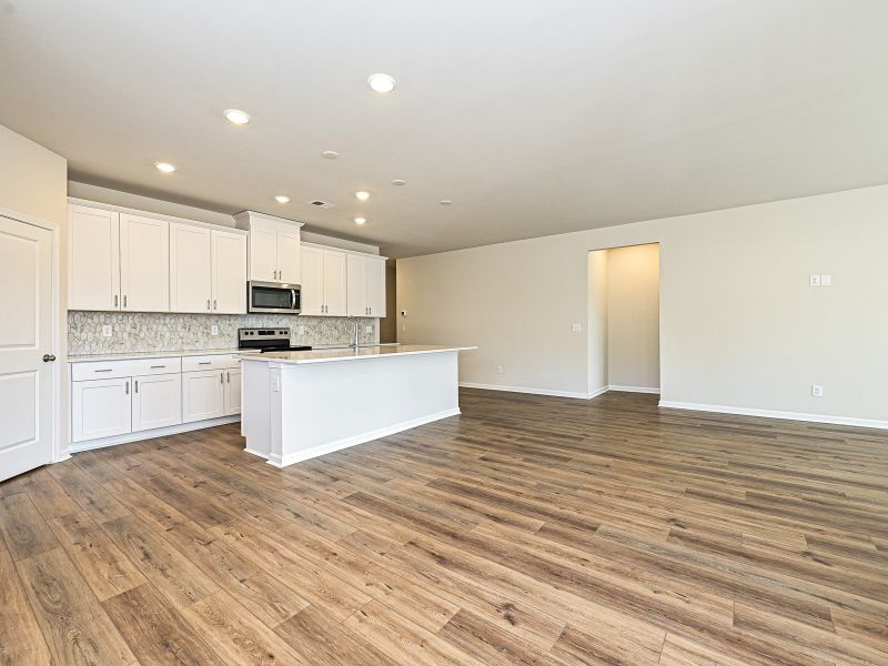 The oversized kitchen island is perfect for a bar counter.