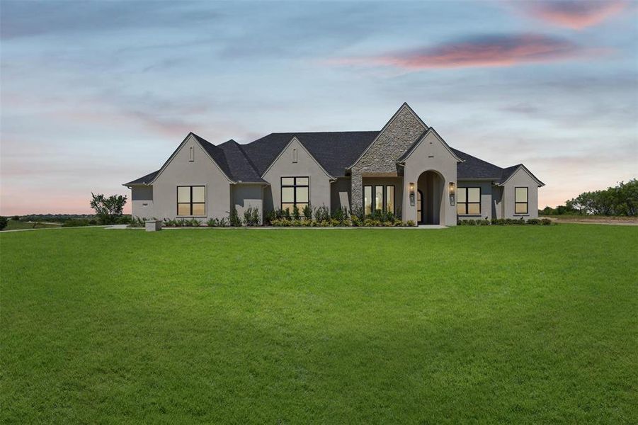 Front exterior of a new home in Bear Creek Ranch, Aledo, TX, highlighting curb appeal (Image 1). Front exterior of a new home in Bear Creek Ranch, Aledo, TX, highlighting curb appeal (Image 1).
