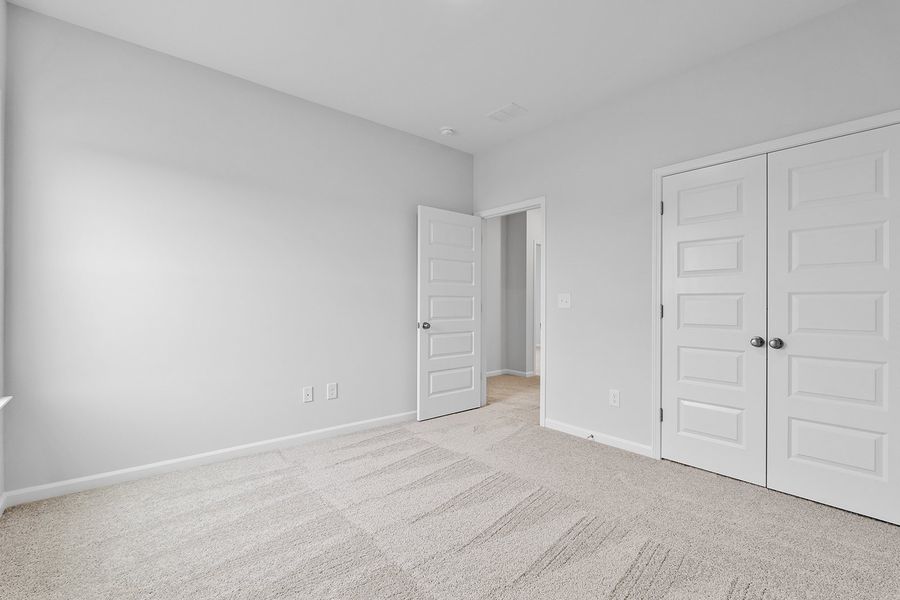 Spacious, unfurnished interior of a new home in Lilah Grove, Summerfield (Image 39).