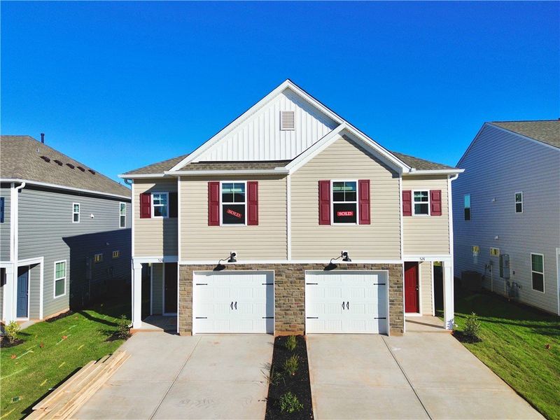 Exterior details and patio area of a home in Champions Village at Cherry Hill, Pendleton (Image 1).