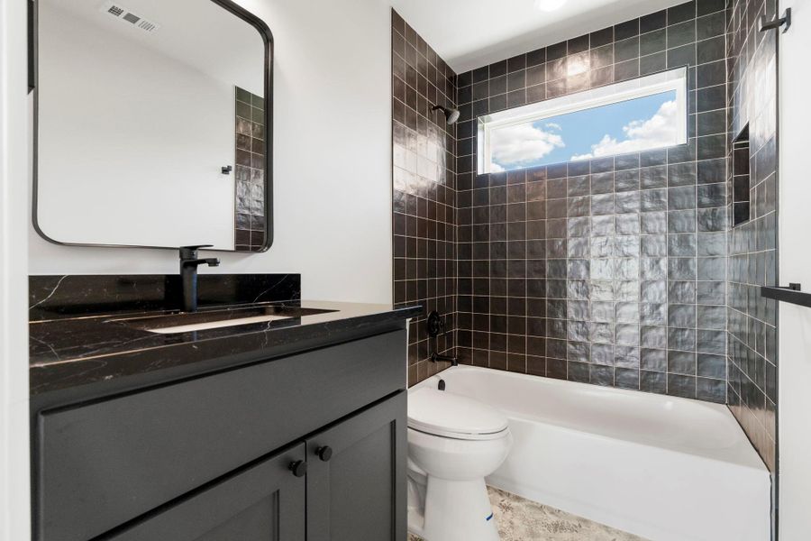 Bathroom with tub / shower combination and vanity