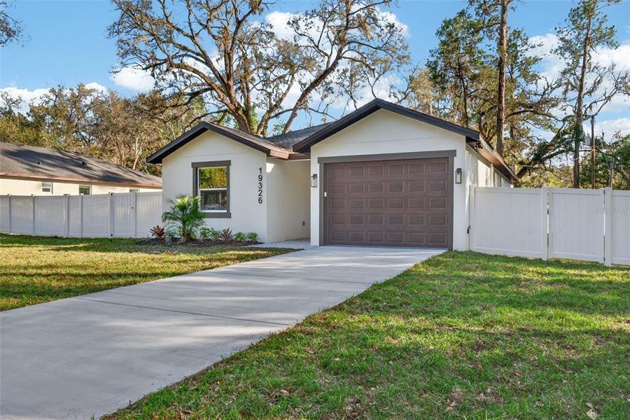 Front exterior of a new home in , Brooksville, FL, highlighting curb appeal (Image 29).