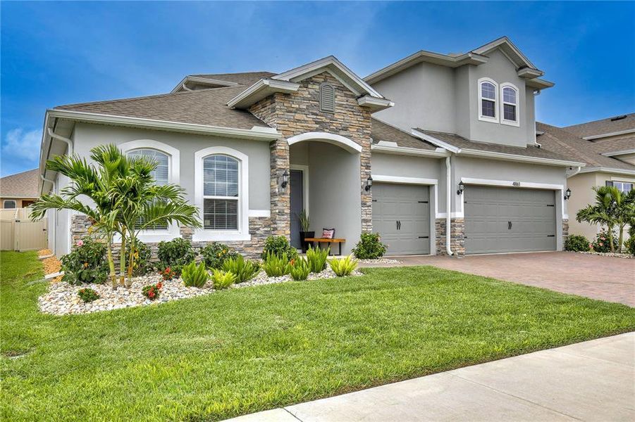 Front exterior of a new home in , Clermont, FL, highlighting curb appeal (Image 27). Front exterior of a new home in , Clermont, FL, highlighting curb appeal (Image 27).
