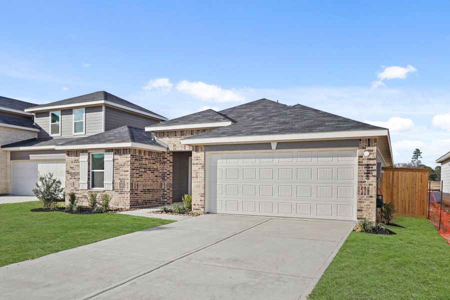 Front exterior of a new home in Maple Woods, Hockley, TX, highlighting curb appeal (Image 2). Front exterior of a new home in Maple Woods, Hockley, TX, highlighting curb appeal (Image 2).