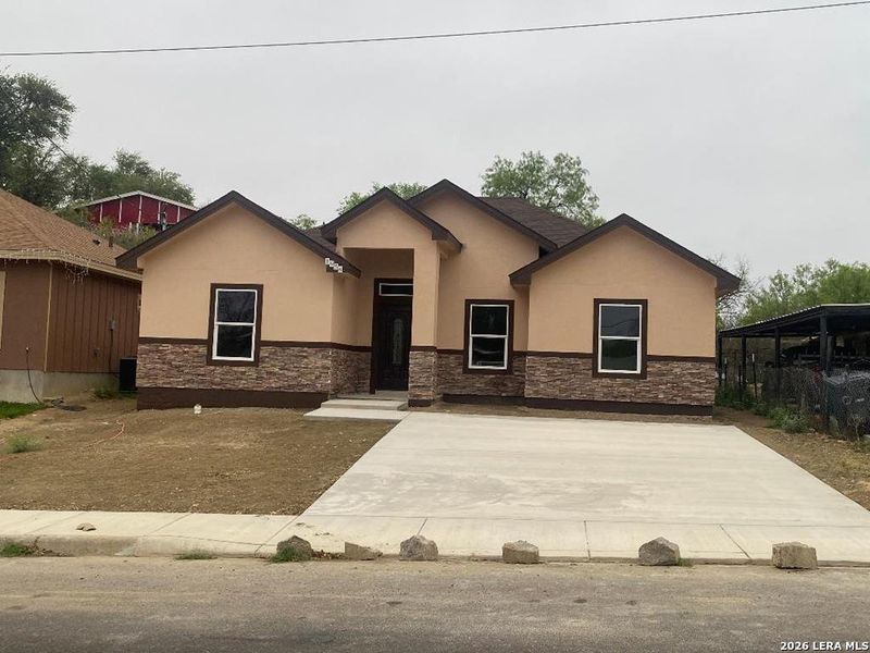 Front exterior of a new home in , Eagle Pass, TX, highlighting curb appeal (Image 15). Front exterior of a new home in , Eagle Pass, TX, highlighting curb appeal (Image 15).