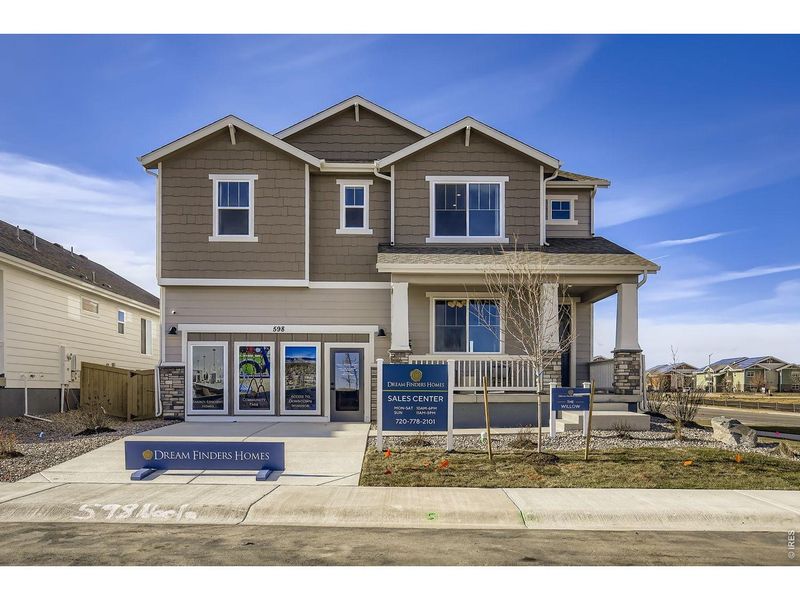Front exterior of a new home in Trevenna, Windsor, CO, highlighting curb appeal (Image 1). Front exterior of a new home in Trevenna, Windsor, CO, highlighting curb appeal (Image 1).