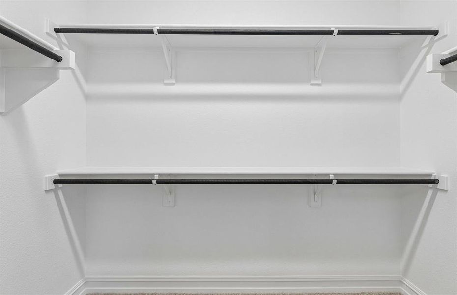 Private walk in closet in  primary suite