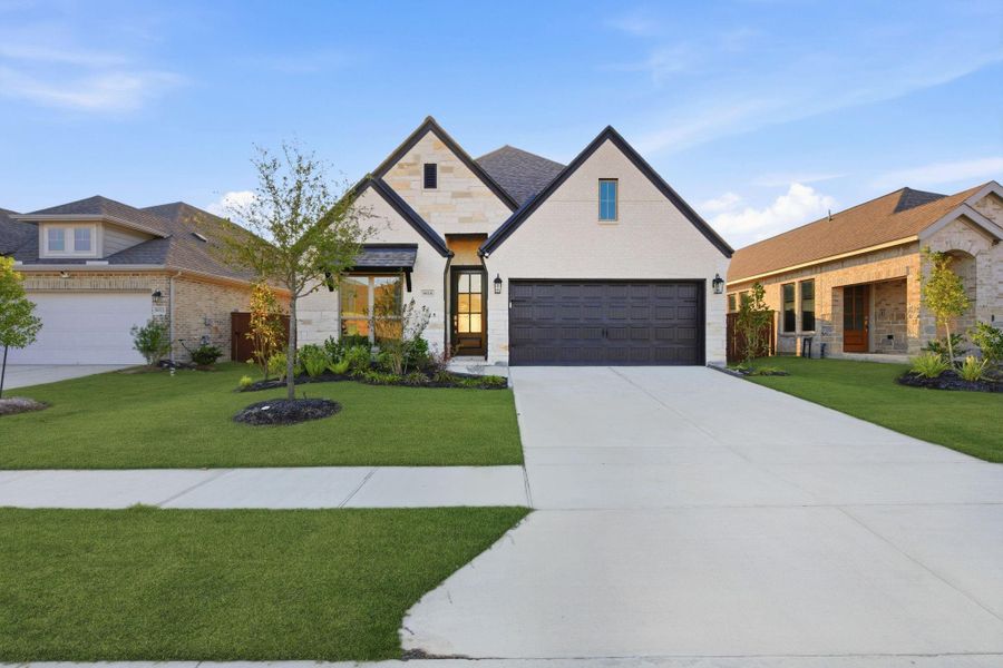 Front exterior of a new home in Meridiana 40'/45', Manvel, TX, highlighting curb appeal (Image 24).
