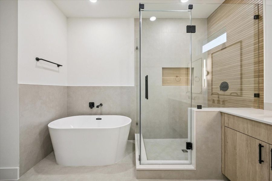 Luxurious primary bath with freestanding tub and walk-in shower Luxurious primary bath with freestanding tub and walk-in shower