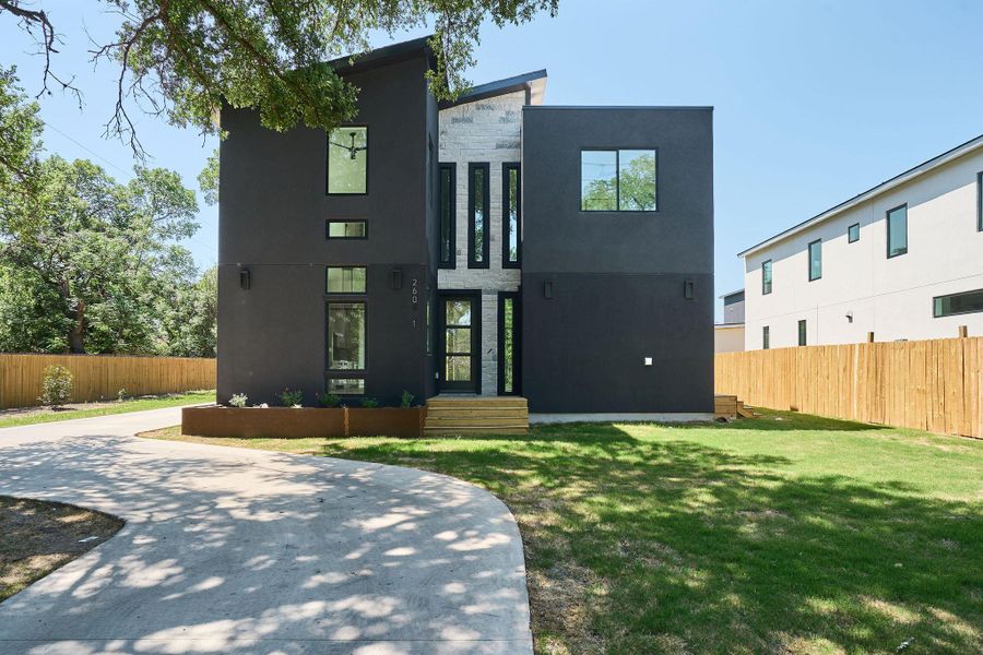 Front exterior of a new home in , Austin, TX, highlighting curb appeal (Image 24).