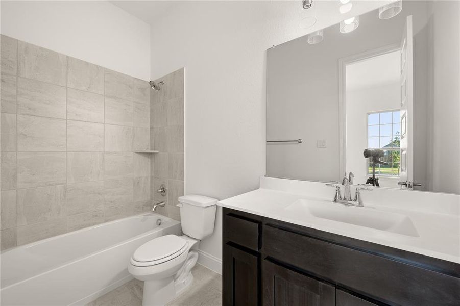Bathroom with vanity and  shower combination