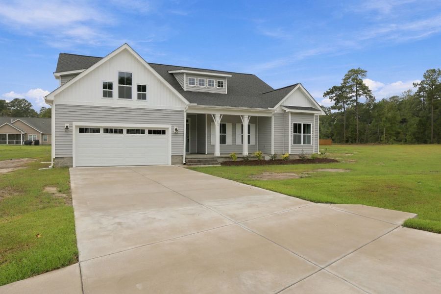 Front exterior of a new home in Laurel Oaks, Greenville, NC, highlighting curb appeal (Image 27).