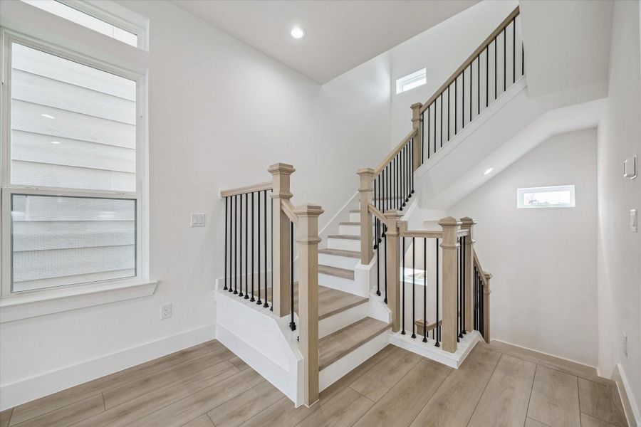 Open stair landing with clean architectural detail and natural light Open stair landing with clean architectural detail and natural light
