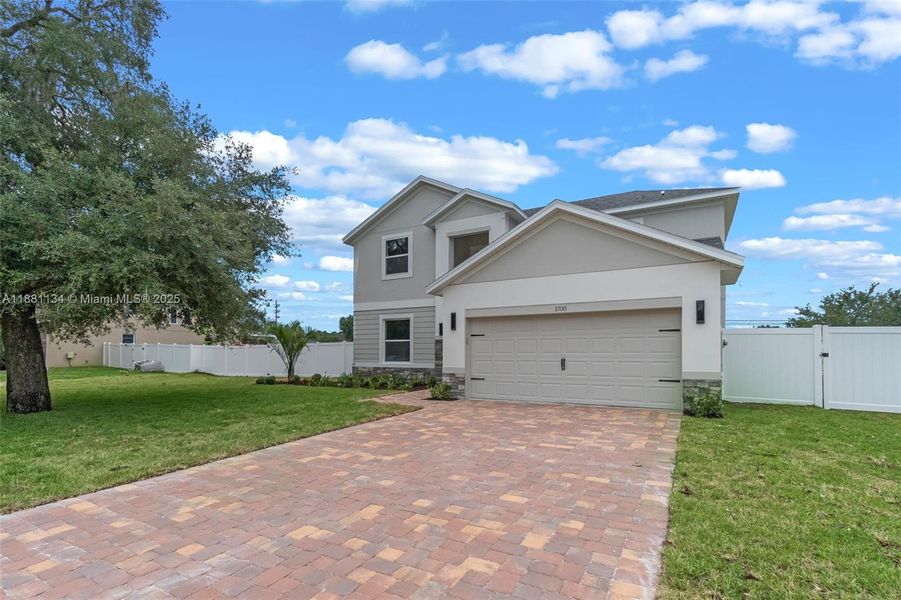Front exterior of a new home in , St. Cloud, FL, highlighting curb appeal (Image 19).