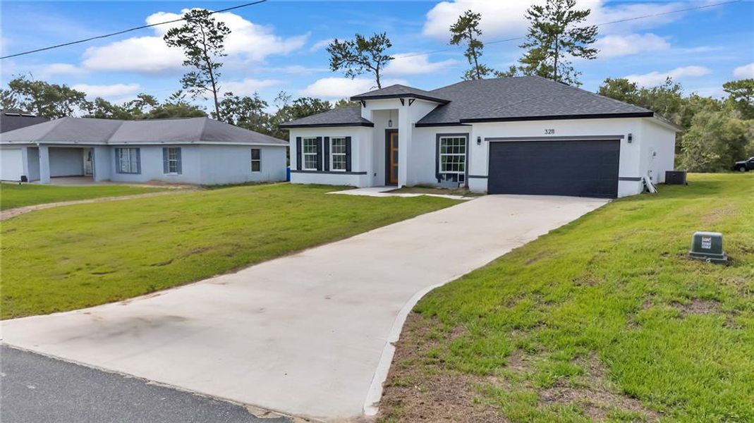 Front exterior of a new home in , Ocala, FL, highlighting curb appeal (Image 23).