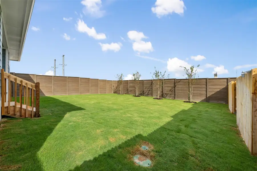Exterior details and patio area of a home in Willow Springs, Buda (Image 2).