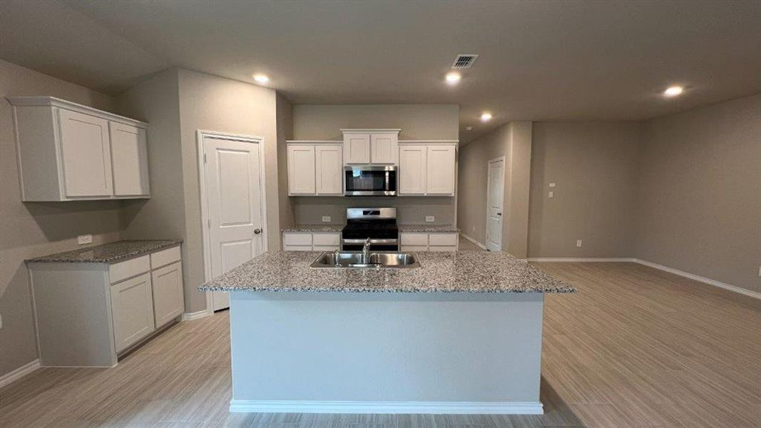 Kitchen-All Home and community information, including pricing, included features, terms, availability and amenities, are subject to change at any time without notice or obligation. All Drawings, pictures, photographs, video, square footages, floor plans, elevations, features, colors and sizes are approximate for illustration purposes only and will vary from the homes as built.