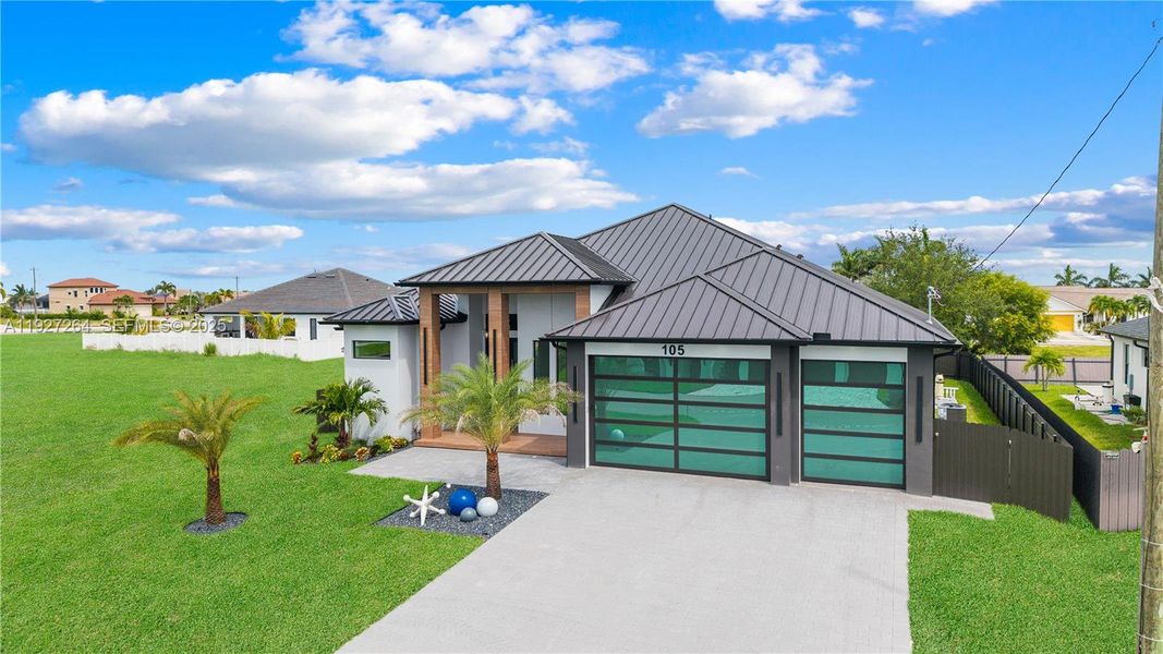 Front exterior of a new home in , Cape Coral, FL, highlighting curb appeal (Image 2). Front exterior of a new home in , Cape Coral, FL, highlighting curb appeal (Image 2).