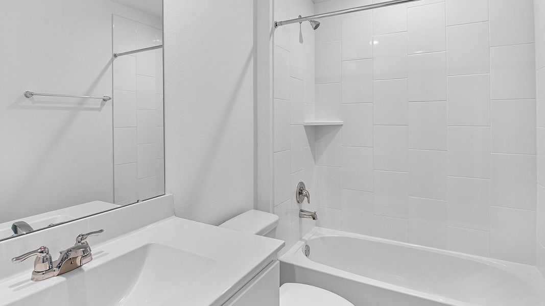 A well-designed bathroom equipped with granite countertops, emphasizing functionality and contemporary style.