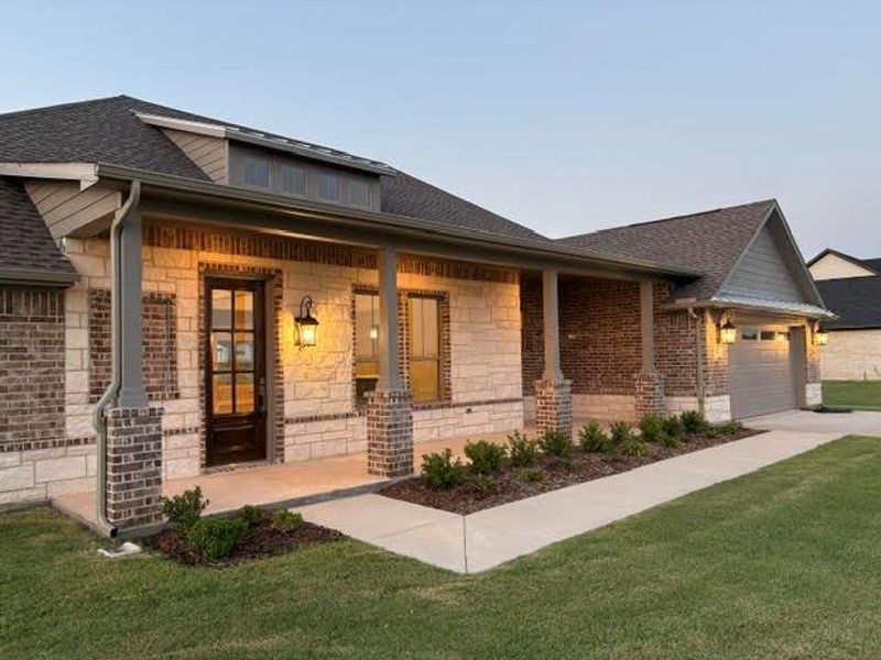 Front exterior of a new home in , Van Alstyne, TX, highlighting curb appeal (Image 24). Front exterior of a new home in , Van Alstyne, TX, highlighting curb appeal (Image 24).