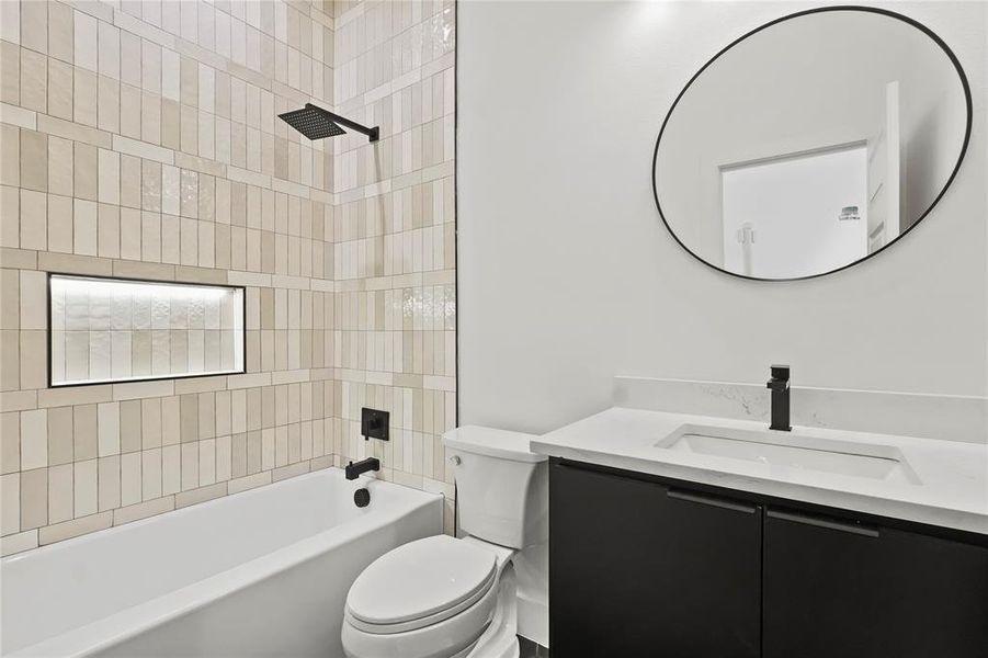 Full bathroom with shower / bath combination and vanity