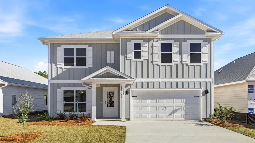 Front exterior of a new home in Bayside at Ward Creek, Panama City Beach, FL, highlighting curb appeal (Image 1). Front exterior of a new home in Bayside at Ward Creek, Panama City Beach, FL, highlighting curb appeal (Image 1).