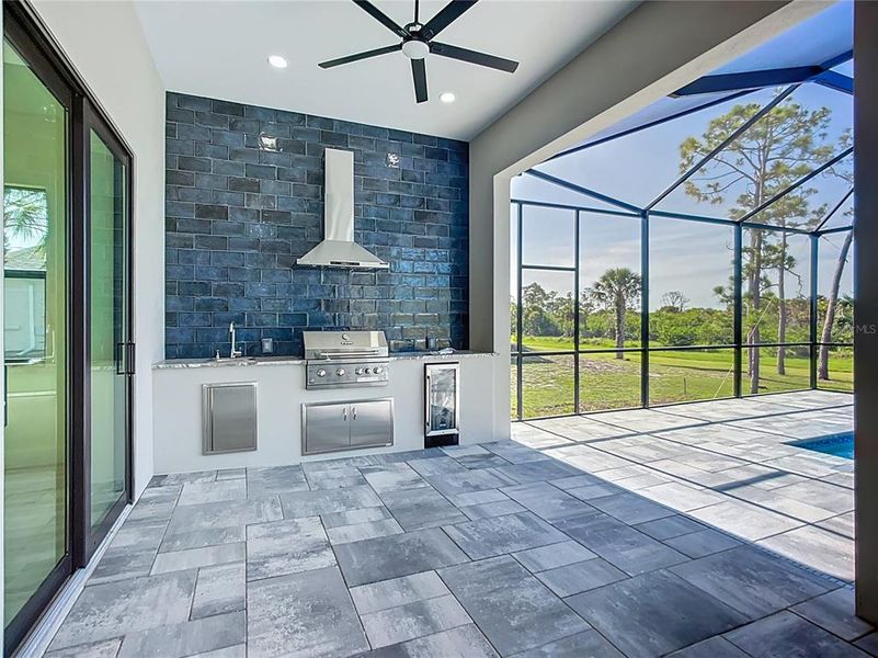 COVERED BACK LANAI WITH OUTDOOR KITCHEN COVERED BACK LANAI WITH OUTDOOR KITCHEN