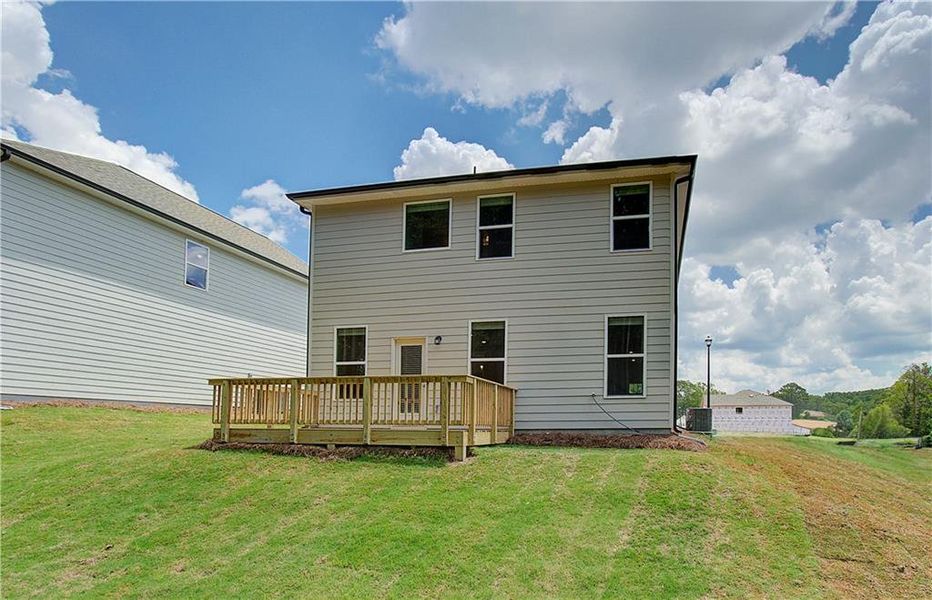 Exterior details and patio area of a home in Enclave at Evergreen, Fairburn (Image 18).
