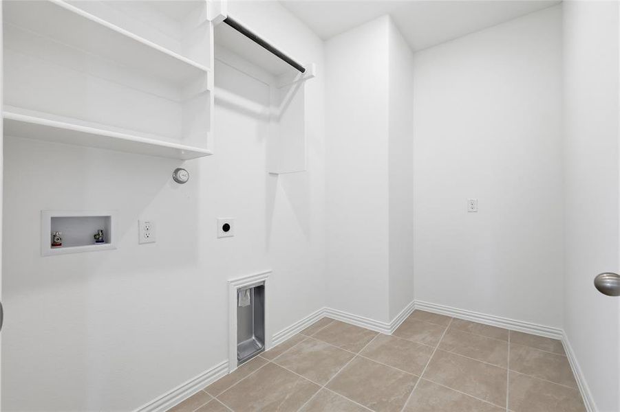 Laundry room with washer hookup, light tile patterned flooring, electric dryer hookup, and gas dryer hookup