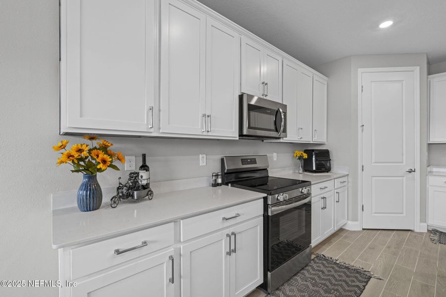 Furnished interior view inside a new home in Edenbrooke at Hyland Trail | 55+: Edenbrooke at Hyland Trail 60s, Green Cove Springs (Image 12). Furnished interior view inside a new home in Edenbrooke at Hyland Trail | 55+: Edenbrooke at Hyland Trail 60s, Green Cove Springs (Image 12).