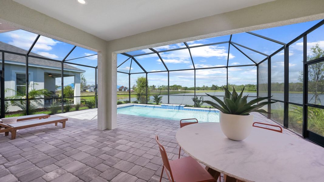 Exterior details and patio area of a home in Wildleaf, Parrish (Image 37).