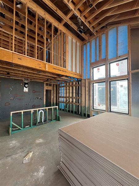 Chef's style kitchen off the breakfast area with a spacious walk-in pantry! The home will feature quartz countertops, stainless steel built-in appliances, pot and pan drawers below the cooktop, and LED under cabinet lighting. Swipe over to see a representation of this space once completed.