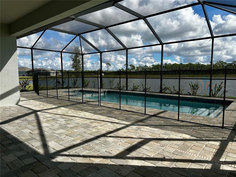 Exterior details and patio area of a home in Island Lakes at Coco Bay: Executive Homes, Englewood (Image 14).