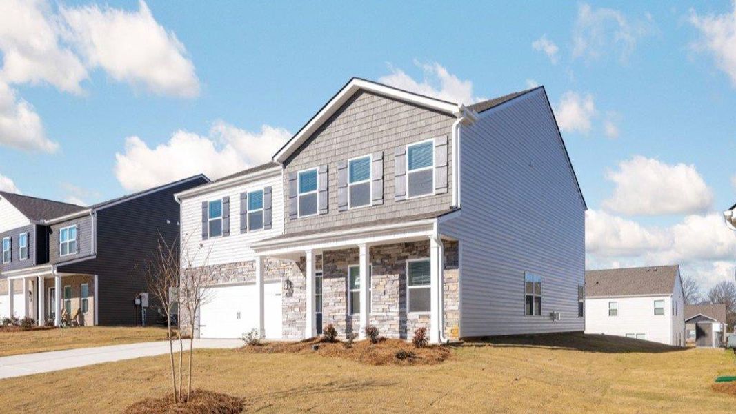 Front exterior of a new home in Sweet Briar, Ooltewah, TN, highlighting curb appeal (Image 20).