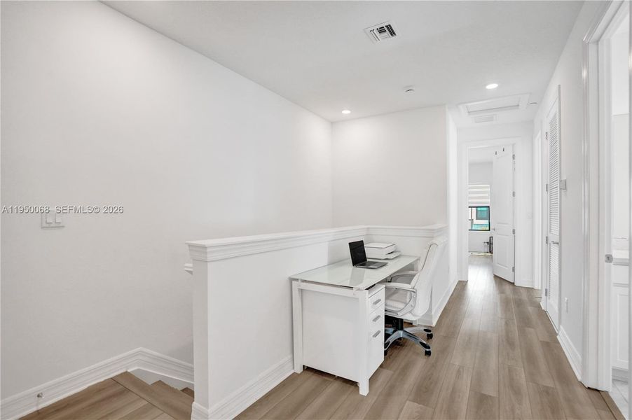 The loft area is large enough for a desk or reading nook