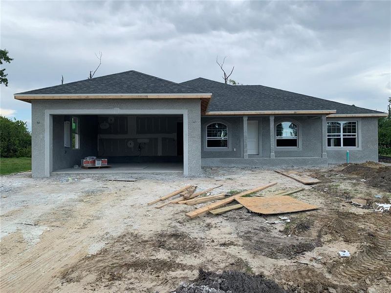 Front exterior of a new home in Rotonda, Rotonda West, FL, highlighting curb appeal (Image 11).