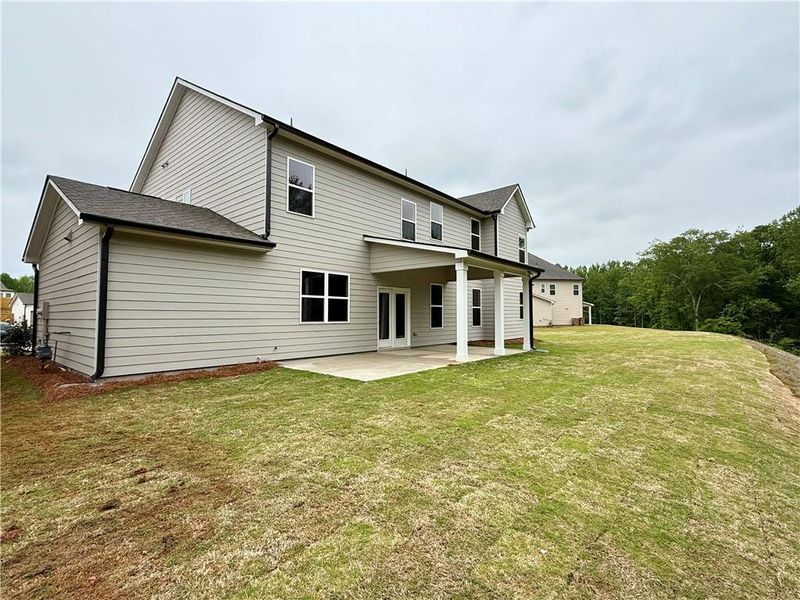 Exterior details and patio area of a home in Ponderosa Farms Reserve, Gainesville (Image 33).