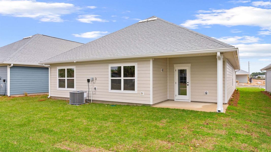 Exterior details and patio area of a home in Caballeros Estates At Hombre, Panama City Beach (Image 3).