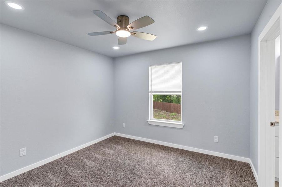 Carpeted spare room with recessed lighting and ceiling fan