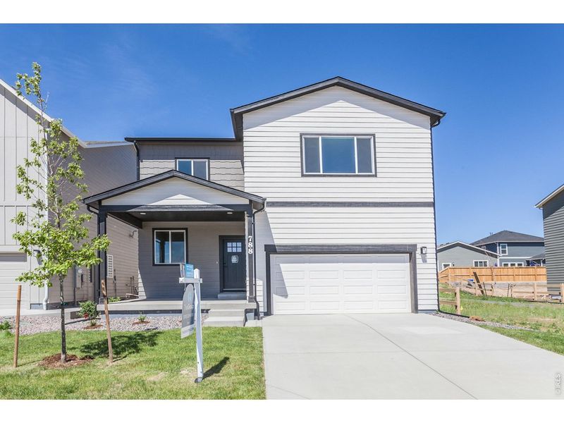 Front exterior of a new home in , Johnstown, CO, highlighting curb appeal (Image 23).