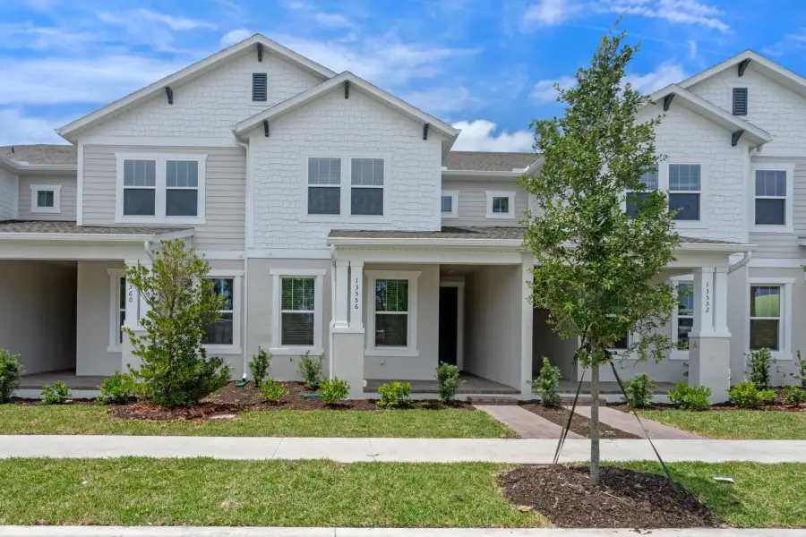 Representative exterior photo of a completed home built from the Newton by Rockwell Homes in Harvest at Ovation - Townhomes, Winter Garden, FL (Image 30). Representative exterior photo of a completed home built from the Newton by Rockwell Homes in Harvest at Ovation - Townhomes, Winter Garden, FL (Image 30).