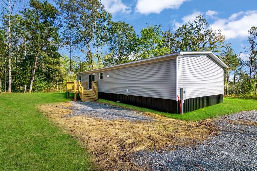 Exterior details and patio area of a home in , Ellijay (Image 1).