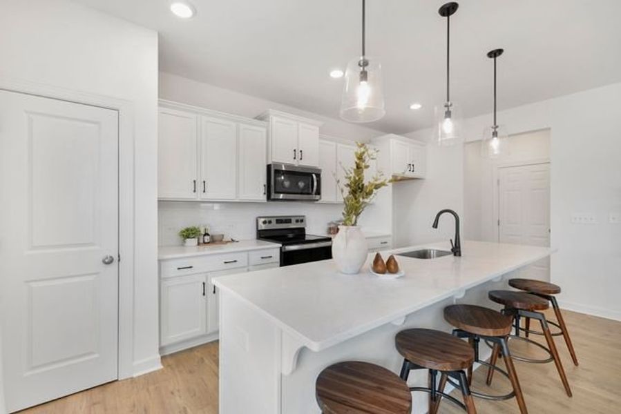 Representative furnished interior of a home built from the TA1800 by True Homes in White Oak Creek Crossing, Angier (Image 4).