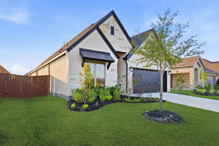 Front exterior of a new home in Meridiana 40'/45', Manvel, TX, highlighting curb appeal (Image 2).
