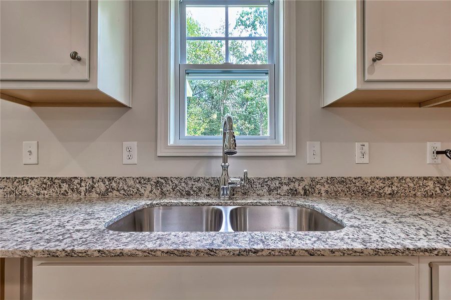 This bright kitchen features a double basin sink,